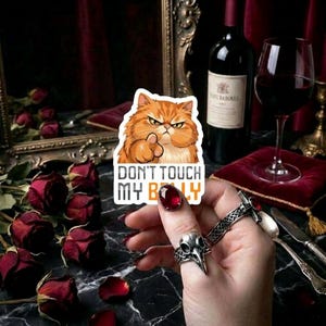 May include: A set of three ceramic mugs with a speckled, matte finish. The mugs are in shades of cream, light gray, and dark gray. Each mug has a simple, minimalist design, perfect for coffee or tea.