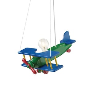 May include: A colourful wooden biplane pendant light. The toy-like plane has a green body, blue wings, and a red propeller. The light fitting includes a visible lightbulb and is suspended by a white cord.