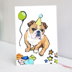 May include: Greeting card featuring a watercolor illustration of a bulldog wearing a party hat and a green balloon. Colorful stars and envelopes are scattered around the dog. The bulldog has brown and white fur.
