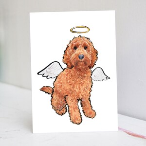 May include: A digital illustration of a brown dog with white angel wings and a gold halo. The dog is sitting with its head tilted slightly to the side.