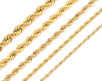May include: Four gold rope chains of varying thicknesses. The chains are arranged in a staggered pattern, with the thickest chain at the top and the thinnest chain at the bottom.
