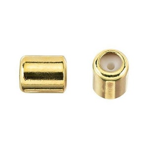 May include: Two gold-colored metal end caps for jewelry making. The end caps have a smooth, shiny finish and a small hole in the center.