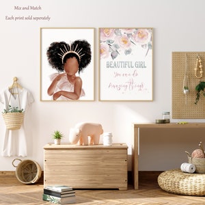 May include: Two framed prints, one with a watercolor illustration of pink flowers and the text "BEAUTIFUL GIRL You can do amazing things", and the other with a digital illustration of a young Black girl with a crown of gold and pink.