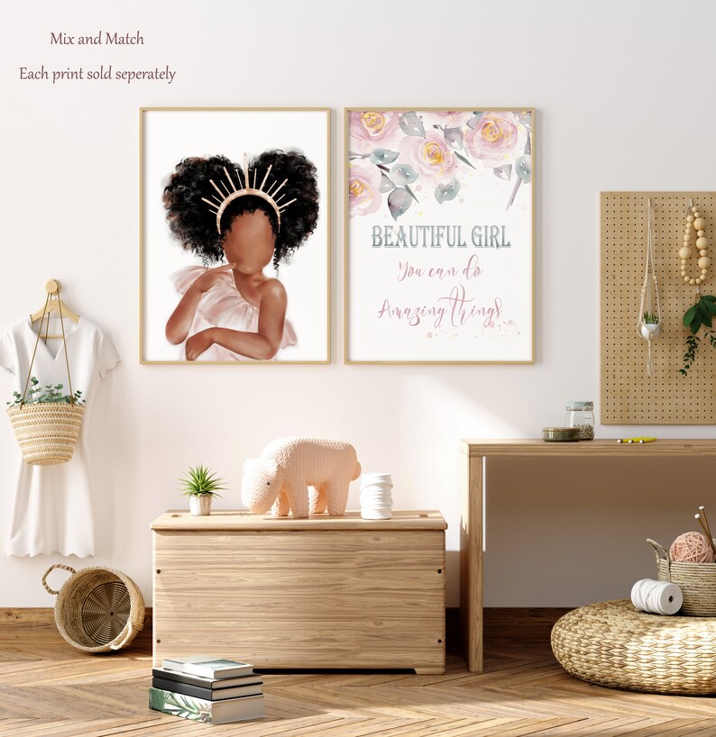 May include: Two framed prints, one with a watercolor illustration of pink flowers and the text "BEAUTIFUL GIRL You can do amazing things", and the other with a digital illustration of a young Black girl with a crown of gold and pink.
