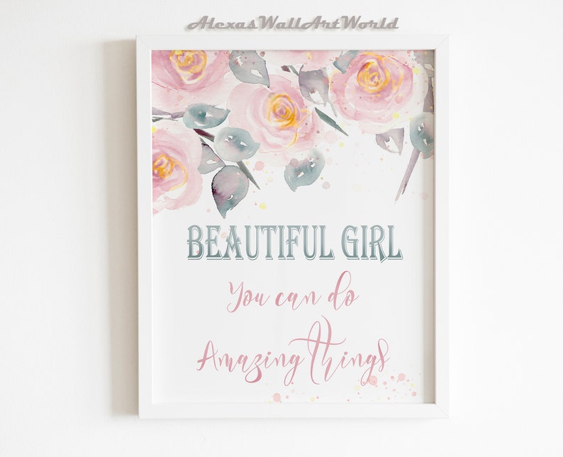 May include: A white framed print with a watercolor painting of pink roses and green leaves. The text "BEAUTIFUL GIRL You can do Amazing things" is written in a decorative font.