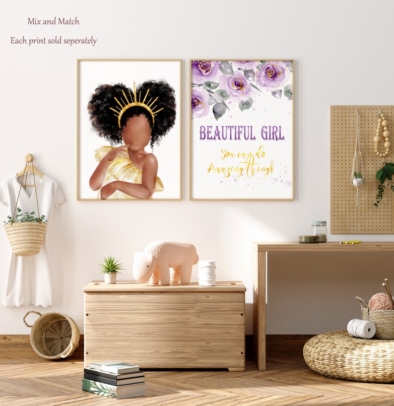 May include: Two framed prints with a white background. The print on the left features a watercolor illustration of a Black girl with a gold crown and a yellow dress. The print on the right features a watercolor illustration of purple flowers with the text "BEAUTIFUL GIRL you can do amazing things".