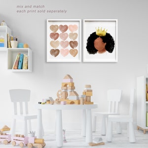 May include: Two framed art prints. One features twelve watercolor hearts in shades of brown and pink. The other depicts a Black woman with a gold crown. The text "mix and match each print sold seperately" is visible.