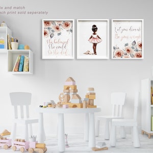 May include: Three framed prints with a pink and white floral design. The prints feature the text "Let your dreams be your wings", "She believed she could so she did", and a silhouette of a ballerina with the text "Let your dreams be your wings".