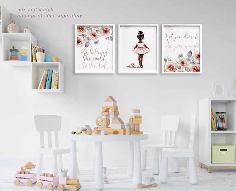 May include: Three framed prints with a pink and white floral design. The prints feature the text "Let your dreams be your wings", "She believed she could so she did", and a silhouette of a ballerina with the text "Let your dreams be your wings".