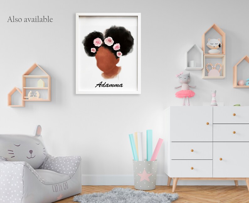 May include: A framed art print featuring a stylized illustration of a woman's profile with dark hair adorned with pink flowers. The name "Adamma" is written below the image in black script. The artwork is displayed in a child's room.