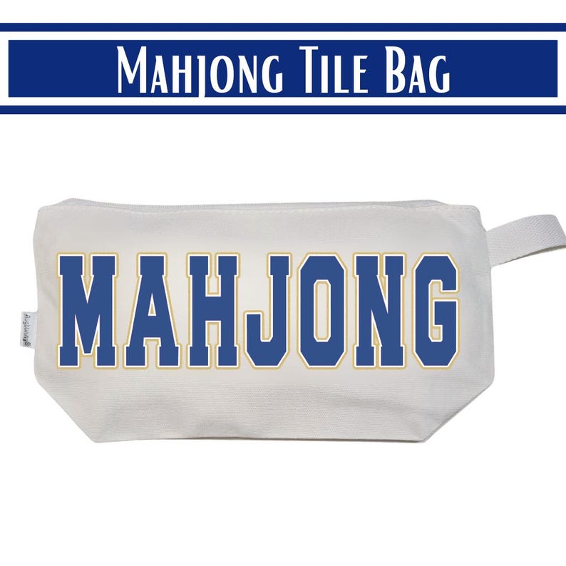 May include: A white rectangular zippered pouch featuring the word MAHJONG printed in large blue block letters with a gold outline. The bag is constructed from a sturdy fabric and includes a small side tab for easy handling and storage of game tiles.