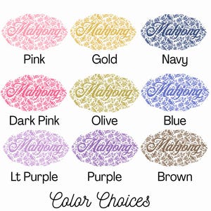 May include: Nine oval-shaped designs with the word "Mahjong" in script, each with a different color and pattern. Colors include pink, gold, navy, dark pink, olive, blue, light purple, purple, and brown. The text "Color Choices" is at the bottom.
