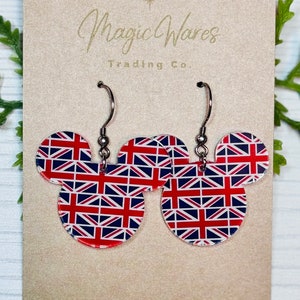 May include: A pair of silver dangle earrings with a Mickey Mouse shaped charm. The charm is red, white, and blue with a Union Jack pattern.