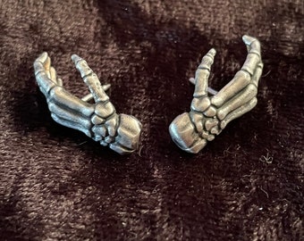 Bone hand stud earrings