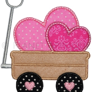 May include: A wooden wagon with a handle and two wheels, filled with three pink hearts. The hearts have different patterns, including polka dots and swirls.