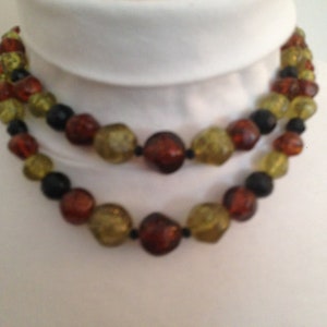1950&#39;s Orange, yellow and black double strand graduated plastic molded bead statement necklace
