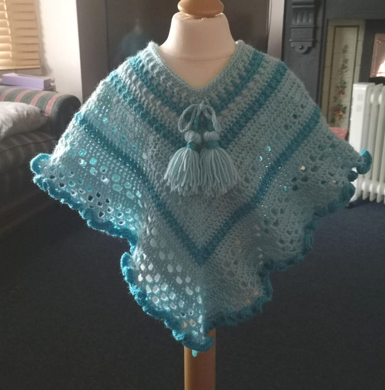 Kids Poncho in Turquoise Tones has wide curly hem and tassel ties for age 2 to 5 years, unique attractive gift for a child image 1