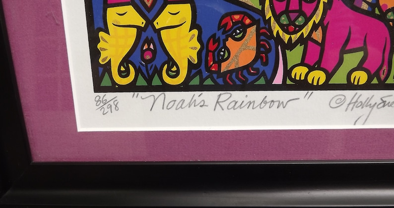 May include: A framed print of a colorful illustration titled "Noah's Rainbow" by Holly Sue. The print features a variety of animals, including seahorses, a crab, and a lion. The print is numbered 86/298.