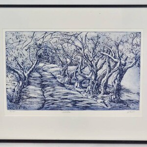 May include: A blue and white print of a landscape with trees and a path. The trees are bare and the path is winding. The print is framed in black.