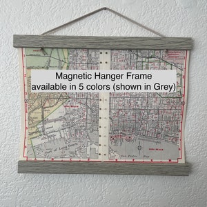 May include: A gray magnetic hanger frame with a map of Long Beach, California. The frame is available in five colors, and the text "Magnetic Hanger Frame available in 5 colors (shown in Grey)" is printed on the map.