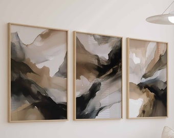 May include: A light beige couch with a wooden frame and three abstract paintings in beige, brown, and black frames above it. The couch is in a living room with a wooden coffee table and a woven ottoman.