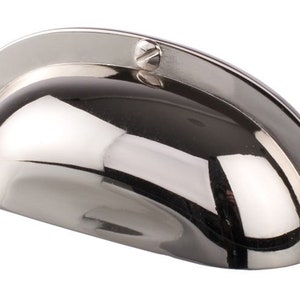 May include: A polished nickel cabinet pull with a rounded, slightly domed shape. The pull has a smooth, reflective surface and three visible screws.