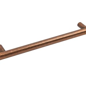 May include: A copper-toned cabinet pull with a smooth, cylindrical design. The pull is approximately 15cm long.