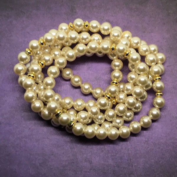 Vintage faux pearls with gold tone spacer beads.