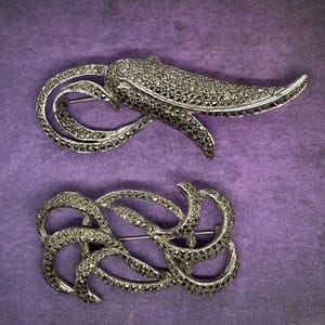Two large Art Deco marcasite brooches.