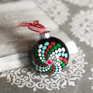 Hand painted dot Mandala on 2.6” black glass ball ornament with white satin ribbon