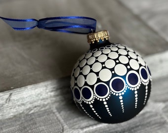 Hand painted dots on 2.6” matte blue glass ball ornament with satin ribbon