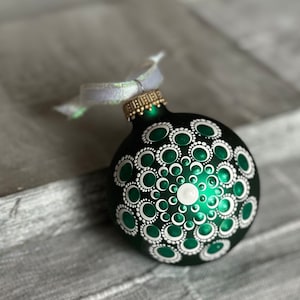 Hand painted dot Mandala on 2.6” matte green glass ball ornament with satin ribbon