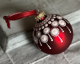 Hand painted dots on 2.6” matte red glass ball ornament with satin ribbon