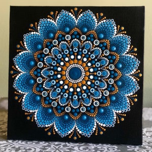 Vibrant Mandala hand painted on black stretched canvas 8&quot; x 8&quot; in shades of blue with white & gold accents