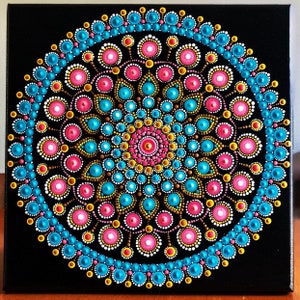 Vibrant dot Mandala on black stretched canvas 10&quot; x 10&quot; in shades of coral, turquoise , yellow, gold, white