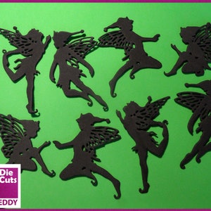 Puede incluir: Siluetas negras de hadas troqueladas con alas detalladas y poses caprichosas, dispuestas sobre un fondo verde. La imagen incluye el texto "Die Cuts" y "Tin Teddy" en un recuadro blanco. El fondo tiene un borde morado.