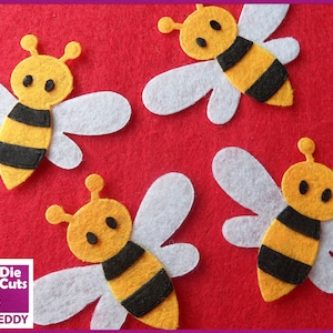 May include: Four felt bee shapes on a red background. The bees are yellow with black stripes and have white wings. The bees have black eyes and antennae.