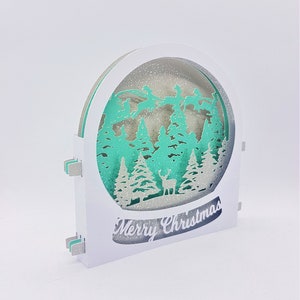 Carte tunnel Cerf de Noël carte tunnel SVG PDF PNG modèle de téléchargement immédiat de découpe de papier Fichier de découpe Boule à neige découpée en 3D Joyeux