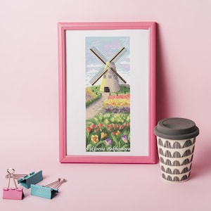 May include: A cross-stitch pattern featuring a colorful windmill with a field of flowers. The pattern is framed in a pink frame and includes the text "Viktoria Pakhomova".