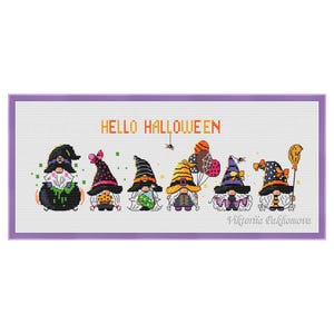 May include: Cross stitch pattern featuring seven gnomes dressed in Halloween costumes. The gnomes are holding various Halloween themed items, including a cauldron, a pumpkin, a candy corn, a spider web, a balloon, a broom, and a wand. The text "HELLO HALLOWEEN" is written above the gnomes.