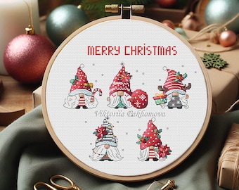 May include: A cross-stitch embroidery hoop featuring five Christmas gnomes with red hats and white beards. The words "MERRY CHRISTMAS" are stitched above the gnomes. The embroidery is set in a wooden hoop, with scissors and ornaments in the background.