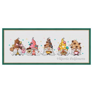 May include: Cross-stitch artwork showing five gnomes, each with a distinctive hat and coffee-related accessories. The gnomes are in a green framed rectangular design. The artist's name, Viktoriia Pakhomova, is at the bottom.