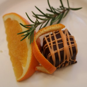 Orange, Rosemary Vanilla; Handcrafted, gourmet caramel in dark chocolate
