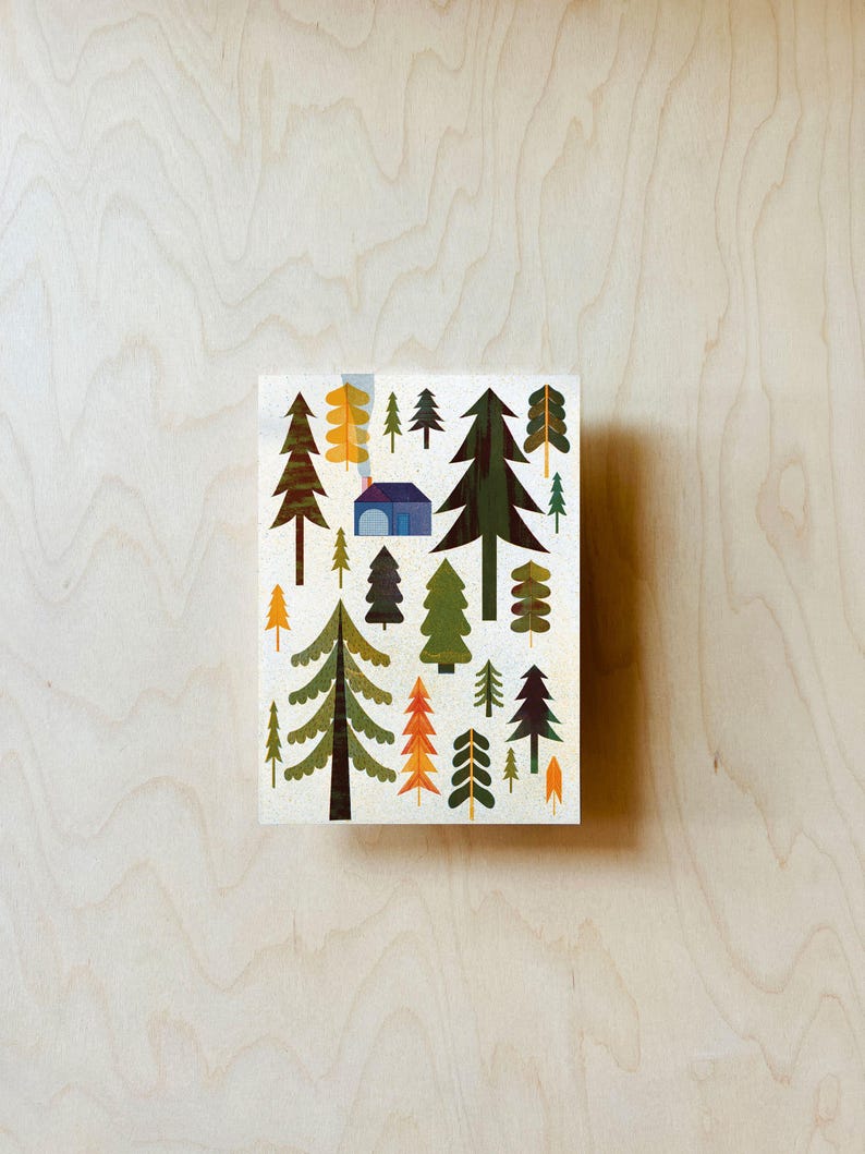 May include: A colourful illustration of a woodland scene with a small blue house in the centre. The trees are stylised and have different colours and shapes, including green, brown, orange, and yellow.