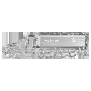 May include: Crystal truck award with the text "Amy Sedaris" and "In Appreciation of 10 Years of Loyal and Dedicated Service". The truck also has the StarBend Trucking logo.