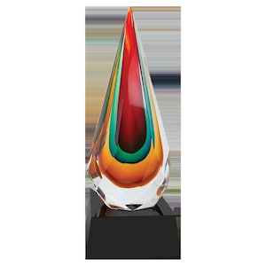 May include: A colorful glass award in the shape of a teardrop with a black base. The glass is layered with red, orange, green, and blue.