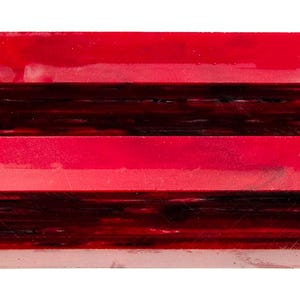 May include: A stack of four rectangular blocks with a glossy finish. The blocks alternate between shades of red and dark burgundy. The top and bottom blocks are a solid red, while the middle two are a darker burgundy.