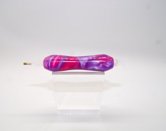 May include: A pink and purple swirl diamond painting pen with a gold tip.