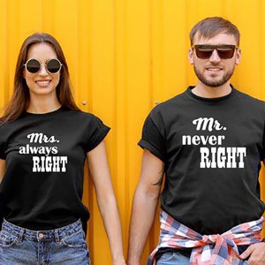 May include: A couple wearing matching black t-shirts with white text. The woman's shirt says "Mrs. always RIGHT" and the man's shirt says "Mr. never RIGHT". They are standing in front of a yellow wall and holding hands.