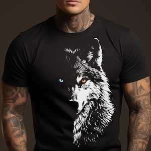 May include: A black t-shirt with a white wolf graphic. The wolf has one blue eye and one orange eye.
